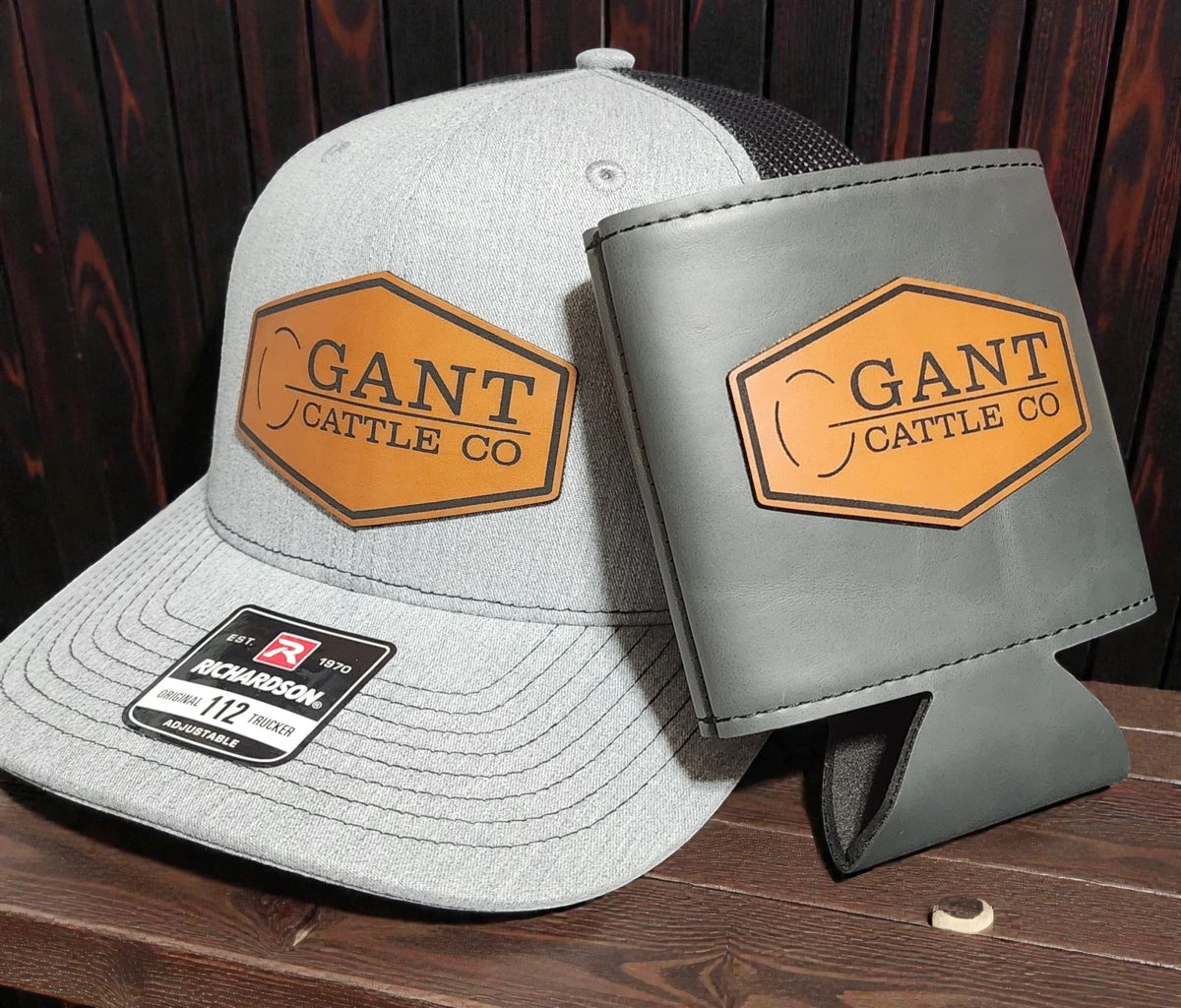 Grey hat and grey can cooler with patches saying "Gant Cattle Co"