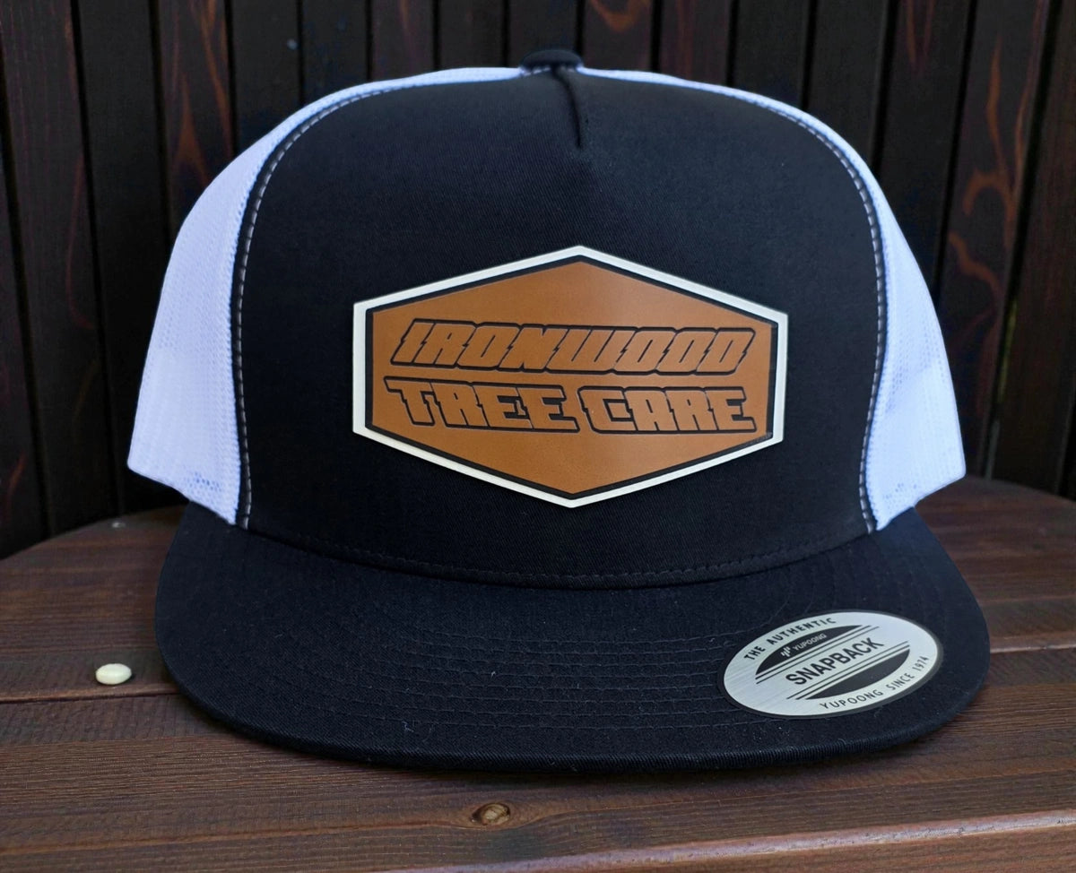 Black and white hat with "Ironwood Tree Care" patch